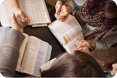 women-praying-together